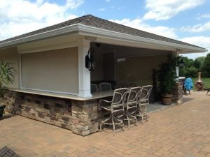 Enclosed outdoor bar and chairs with Sentry patio screen